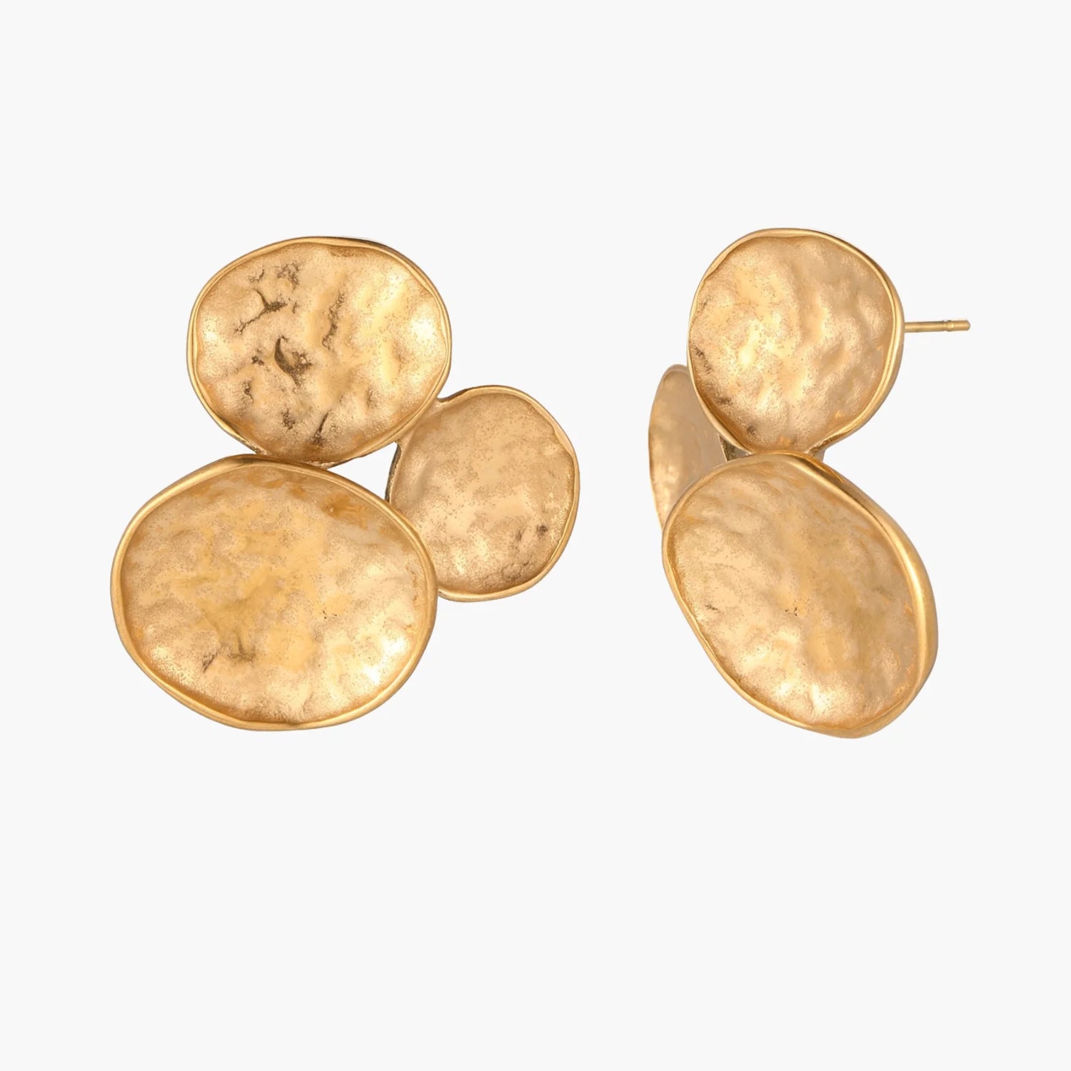 Three hammered gold discs clustered together forming organic statement earrings with textured surfaces