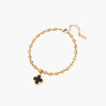 18K gold-plated oval bead chain bracelet with quatrefoil clover charm featuring mother of pearl inlay on cream background