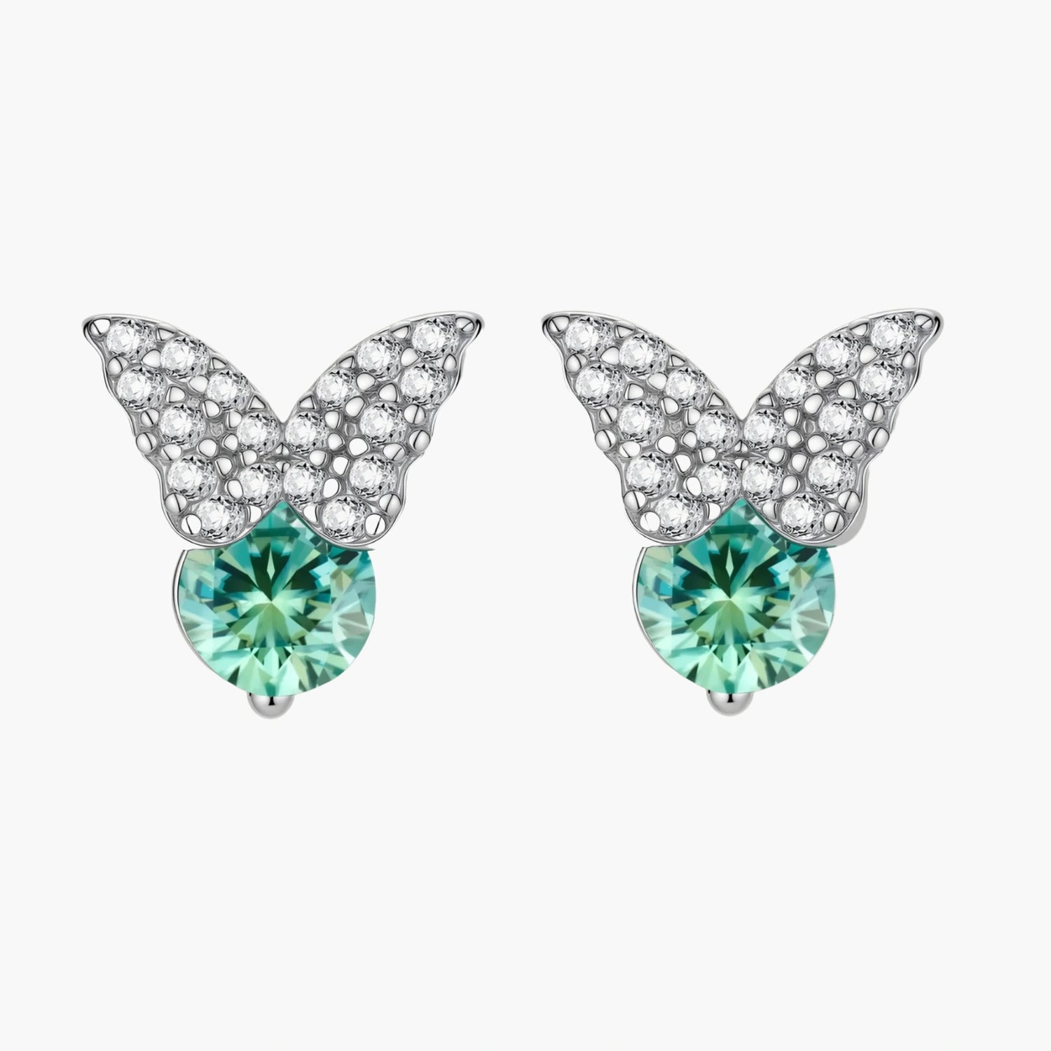 Sterling silver butterfly stud earrings with crystal wings and mint green center stones on cream background.