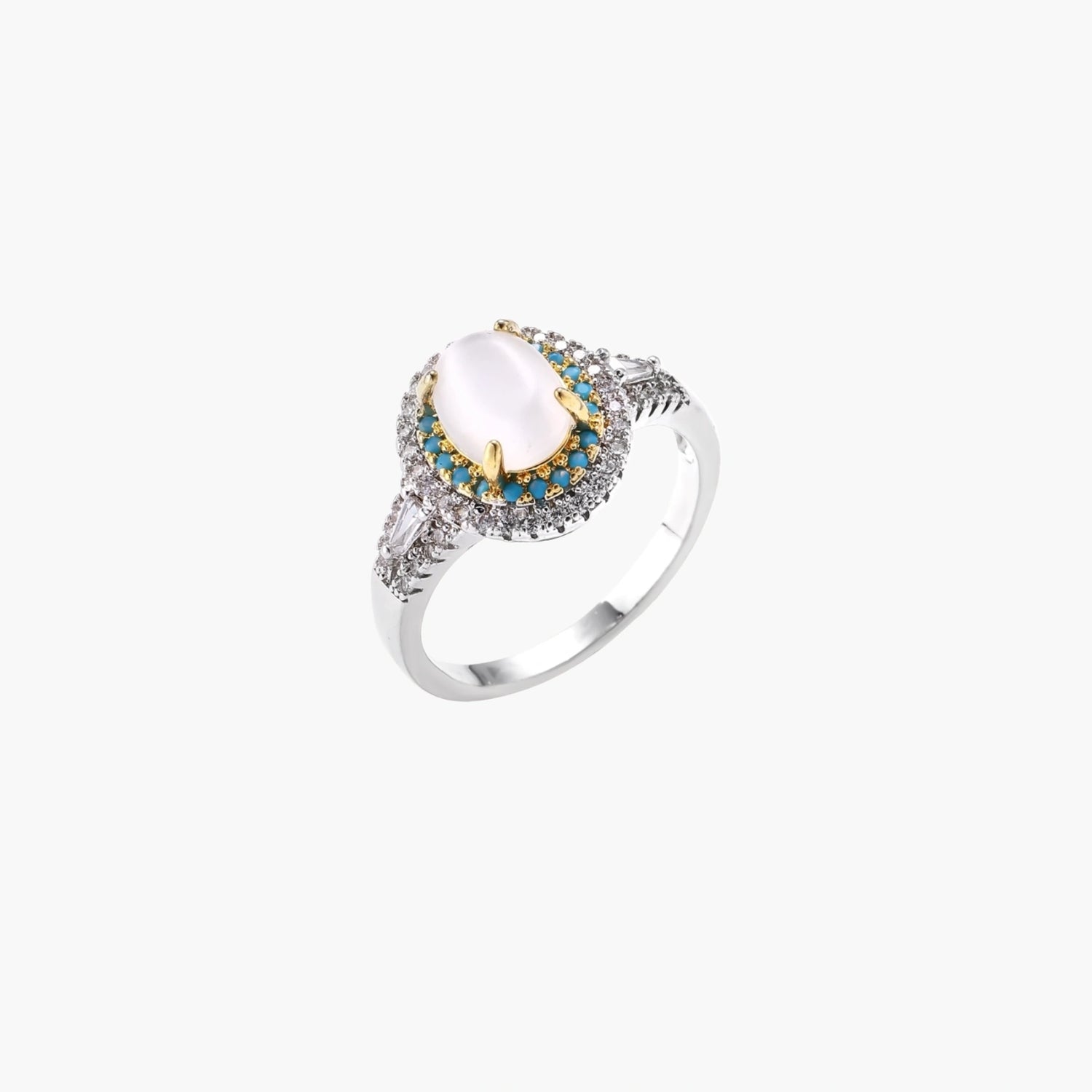 Vintage-style cocktail ring with luminous cat's eye center stone surrounded by turquoise and crystal double halo on white gold plated band