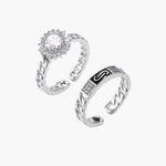 Two adjustable white gold plated rings with chain-link bands, featuring cubic zirconia halo and enamel details