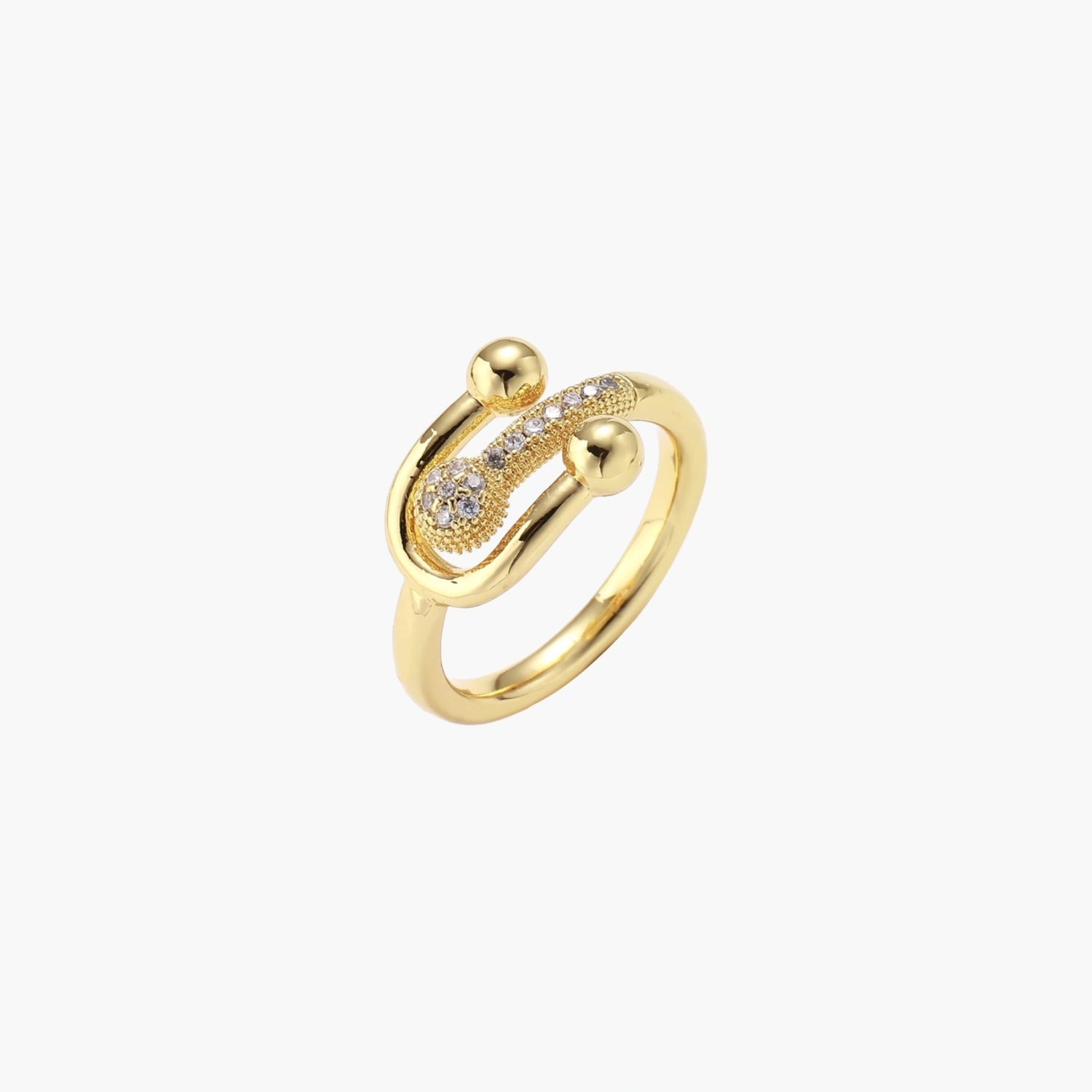 Gold-plated brass ring with safety pin design featuring pavé cubic zirconia stones and dual sphere ends