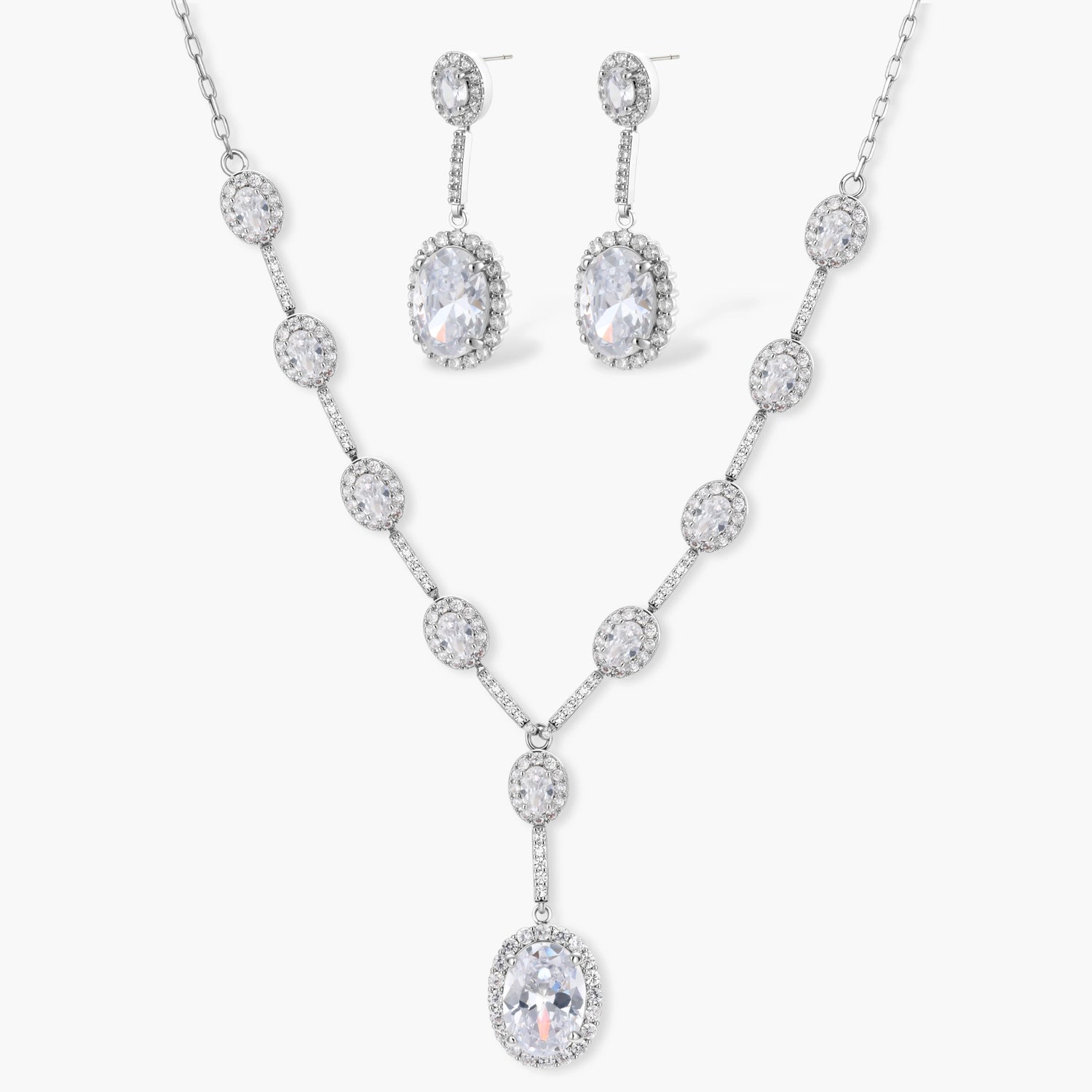 Elegant white gold plated jewelry set with oval cubic zirconia stones in halo settings, featuring Y-necklace and drop earrings.