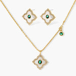Gold-plated jewelry set with diamond-shaped pendants featuring white centers, green stones, and sparkling zirconia borders